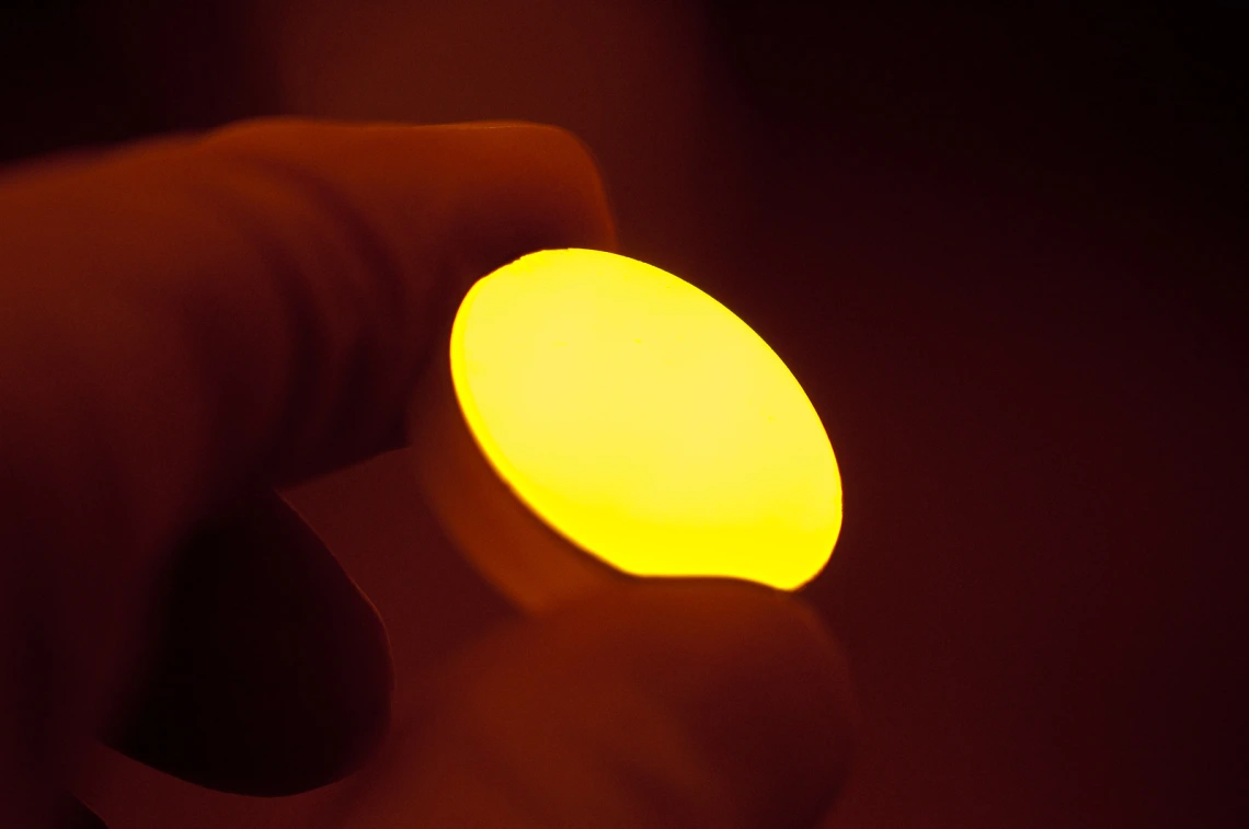 Golden disk in fingertips